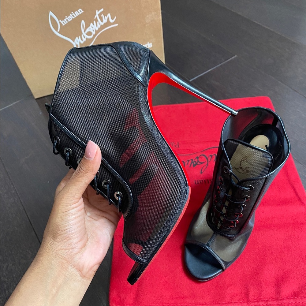 Christian Louboutin Ondessa sheer mesh and leather booties.